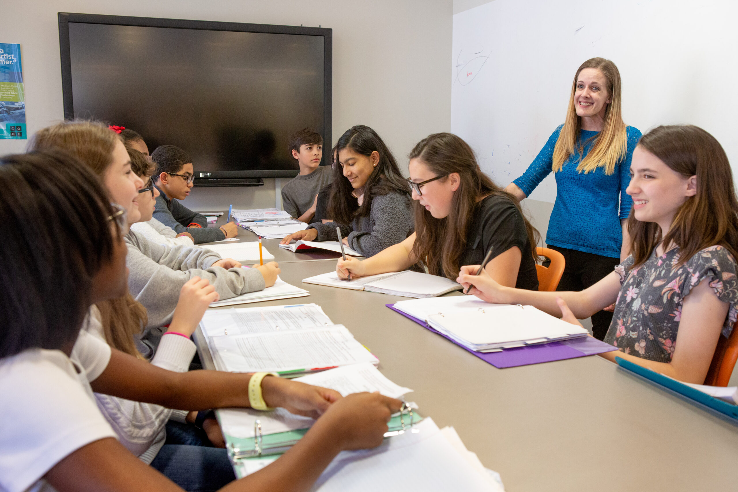 teacher teaching around a table